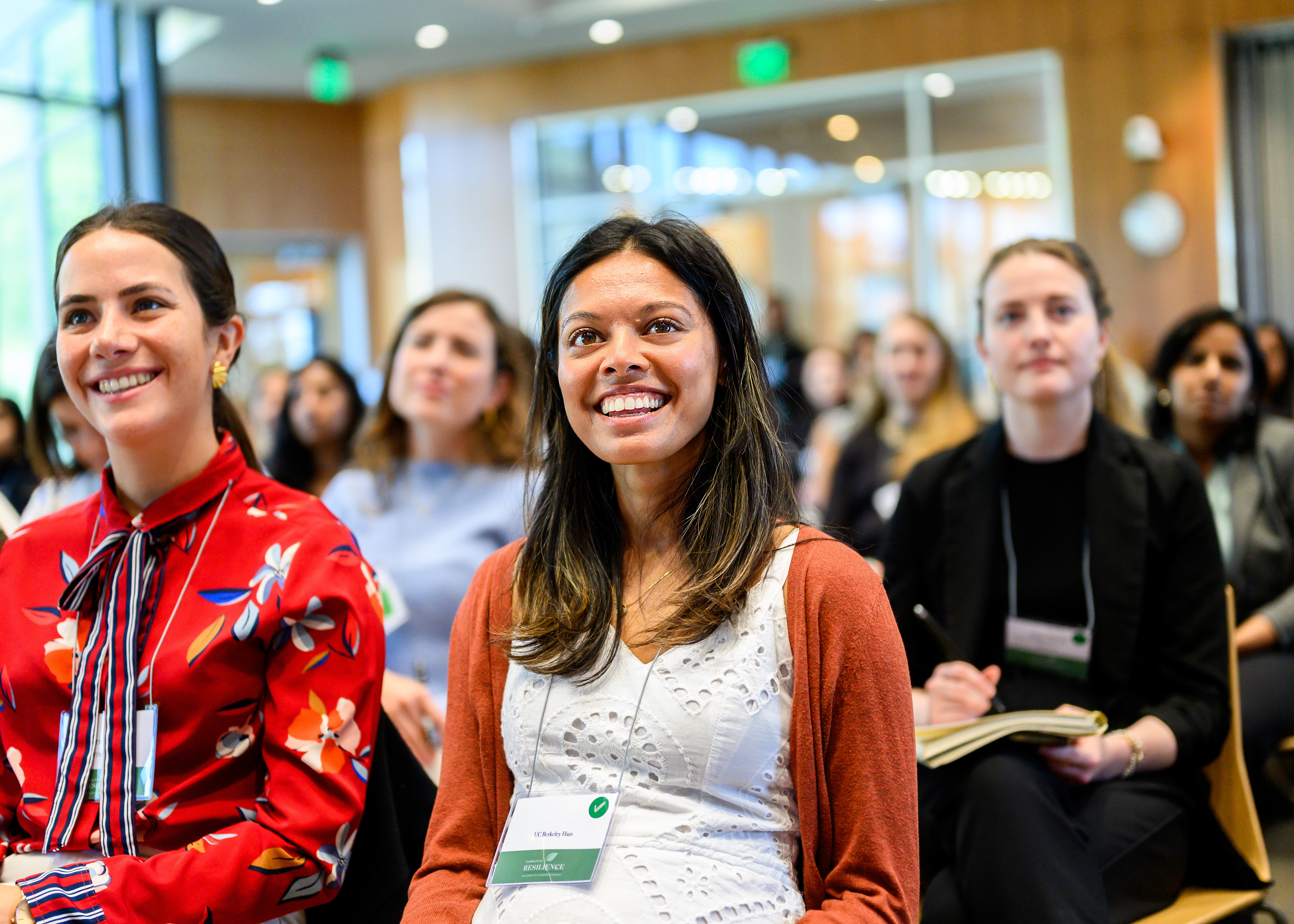 Female students smiling during class